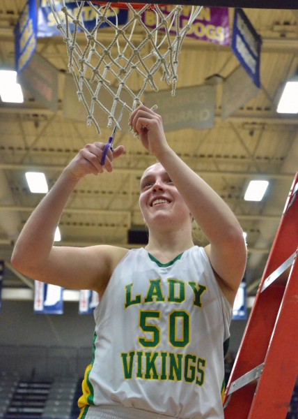 Anne Secrest never stopped smiling following the final buzzer of Saturday's regional title win over Norwell. (Photos by Nick Goralczyk)