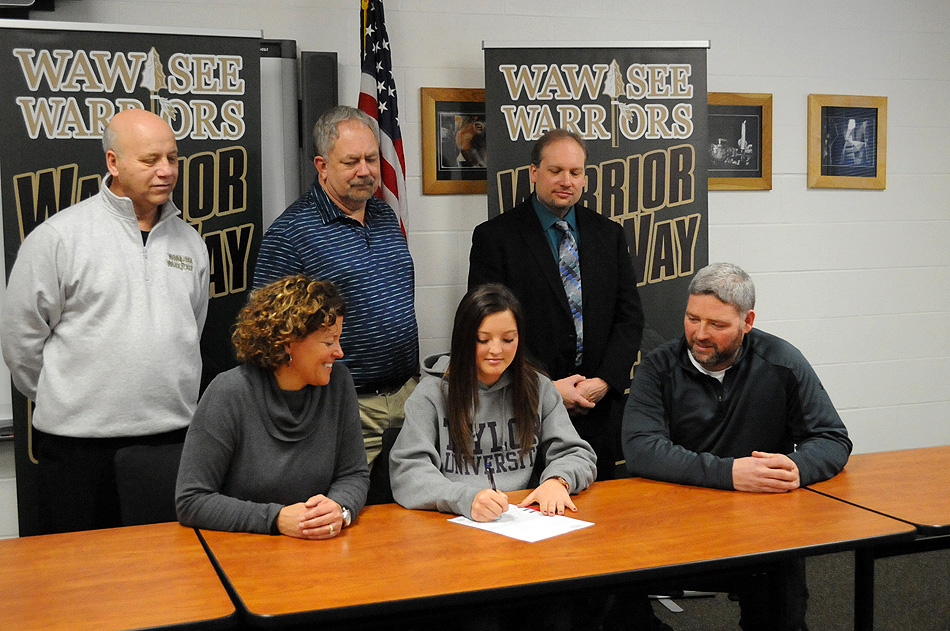 Wawasee High School senior Elizabeth Jackson signed her letter of intent Wednesday to continue her golf career at Taylor University. Seated with Elizabeth are parents Leslie and Bruce Jackson. In back are WHS athletic director Steve Wiktorowski, WHS golf head coach Steve Coverstone and WHS principal Mike Schmidt. (Photo by Mike Deak)
