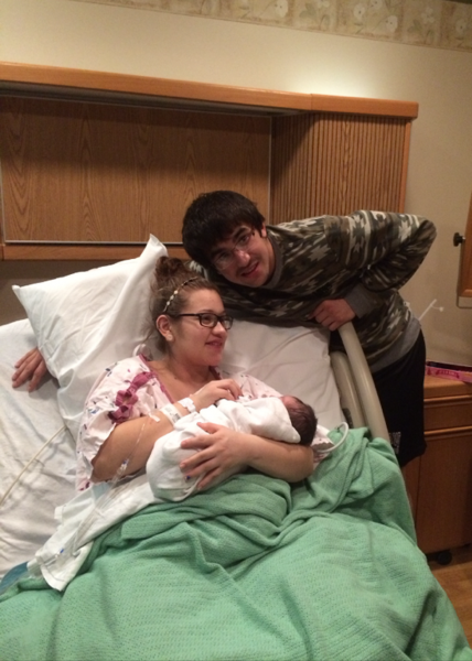 Warsaw senior wrestler Rory Nolin (standing) beams with pride as he poses for a picture with his newborn daughter Sophia Arielle and girlfriend Miriam Lopez. (Photo provided)