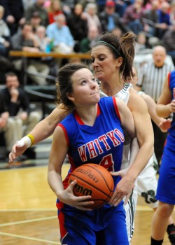 Whitko's Hanna Yohe is smothered by Wawasee's Elizabeth Jackson.