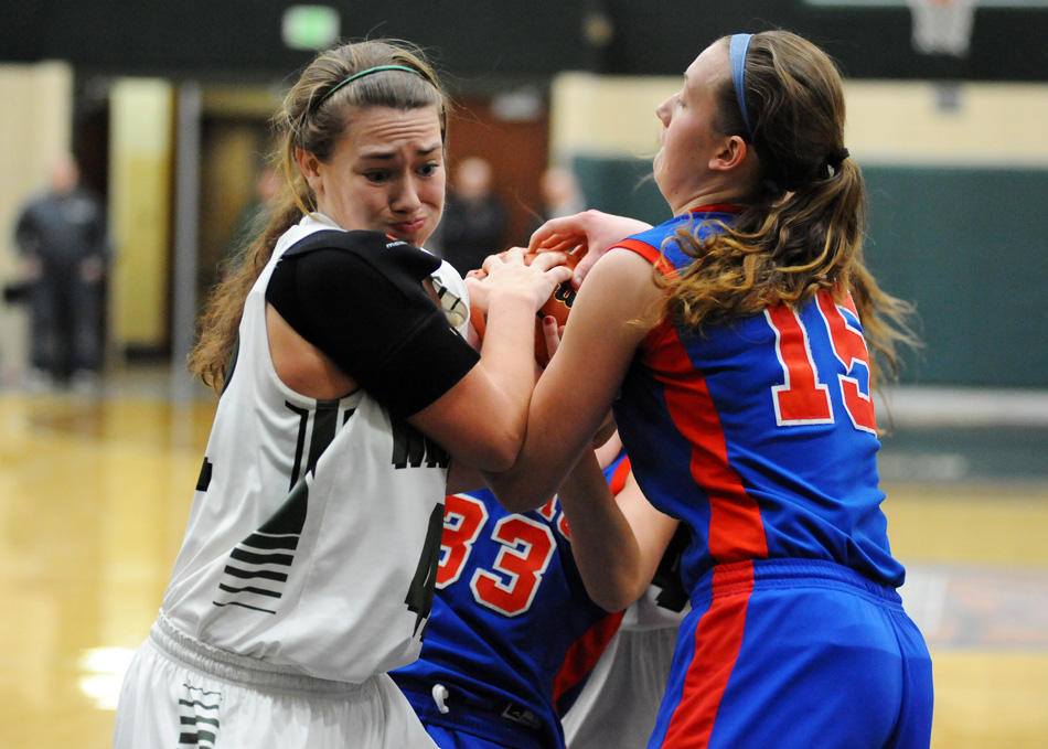 Wawasee's Aubrey Schmeltz battles for a rebound against Whitko.