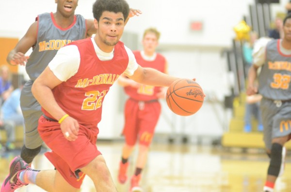 Rashaan Jackson of Warsaw heads up the floor Monday night during the McDonald's Michiana All-Star game at Bethel College.