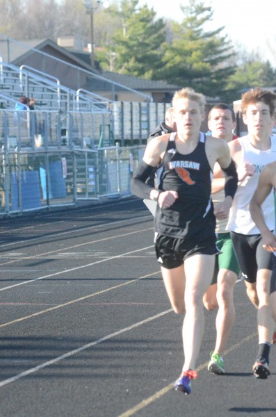 Owen Glogovsky leads the pack for Warsaw in the 1,600, which he won.