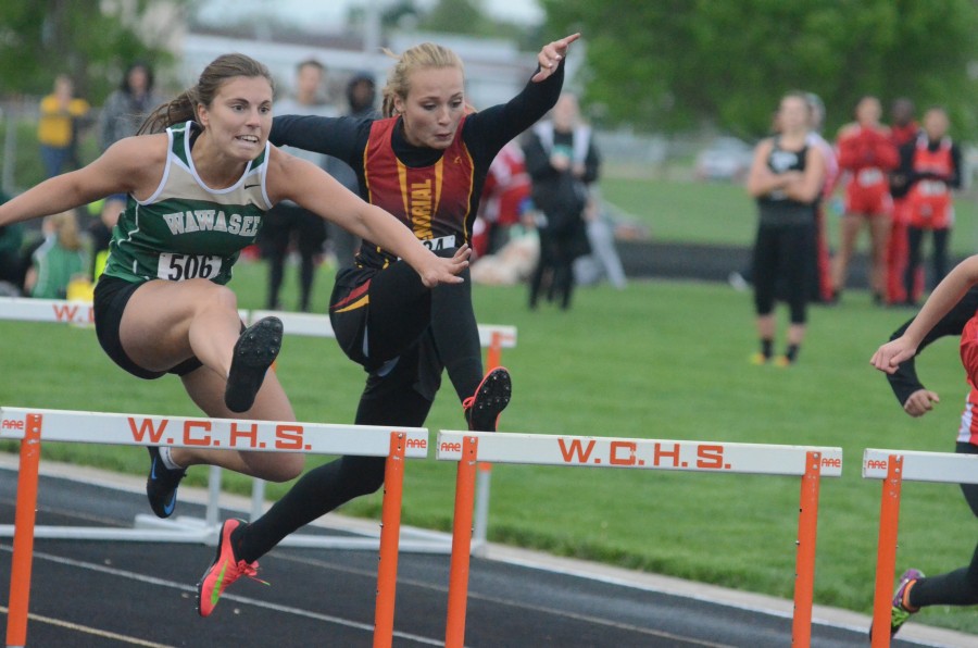 Shelby Swartz (at left) was third in the 100 hurdles for Wawasee.