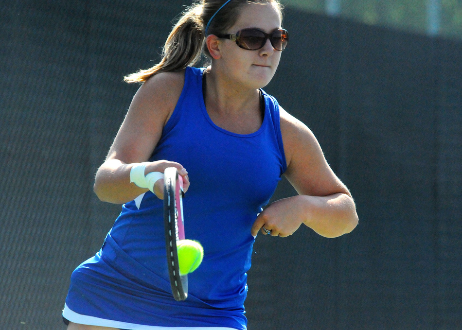 Whitko's Morgan Keim sends a shot toward Tippecanoe Valley one singles opponent Hanna Dalrymple at the Warsaw Girls Tennis Sectional.