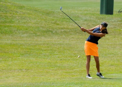 Delaney Wihebrink of Warsaw chips over the hazard on No. 3.