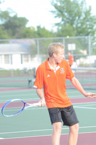 Andrew Gauger prepares to return a shot Tuesday for Warsaw. The Tigers beat host Wawasee 5-0.