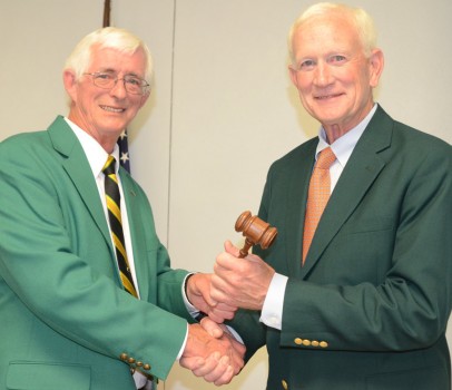 Rich Utley, 2015 fair board president, hands the gavel to Dr. Robert Zell, 2016 fair board president.