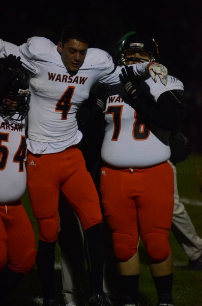 Warsaw star receiver Riley Rhoades is helped from the field after suffering a knee injury at Concord Friday night.