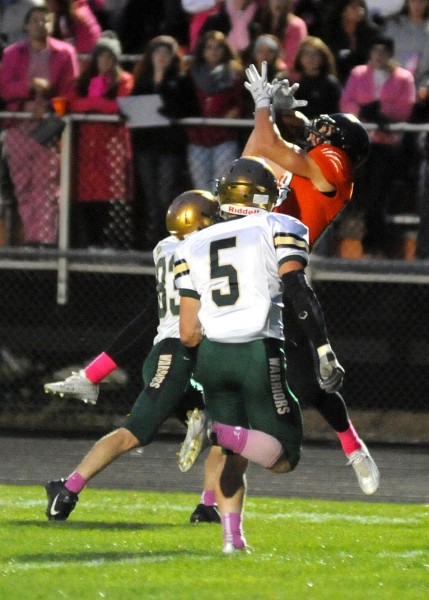 Warsaw's Tommy Hickerson hauls in a touchdown during a 21-0 win over Wawasee last week. The Tigers host NorthWood Friday night (File photo by Mike Deak)