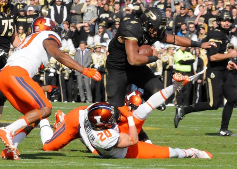 Purdue running back Markell Jones drags an Illinois defender.