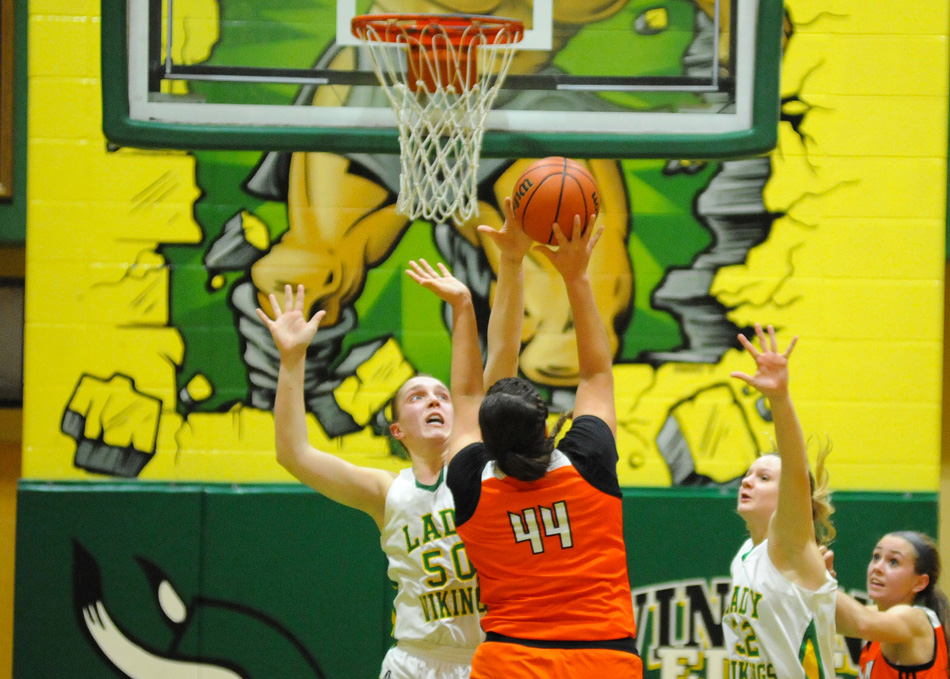 Tippecanoe Valley's Anne Secrest blocks the shot of Warsaw's Lauren Shaffner late in the fourth quarter of Valley's 45-42 win Friday night. (Photos by Mike Deak) 