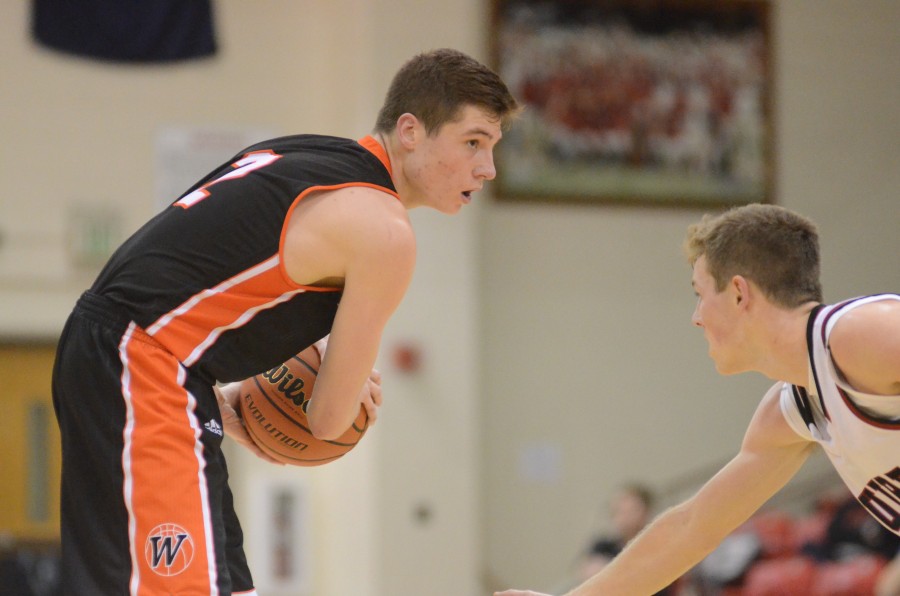 Kyle Mangas stares down his defender Thursday night. The Warsaw star poured in 25 points as the Tigers remained undefeated with a 46-36 win at Manchester.