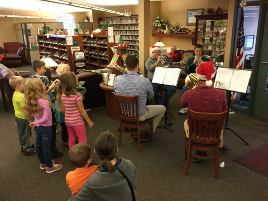 Children from the North Webster Latch Key recently stopped by the North Webster Library to listen to music performed by Matthew Murdock, Eric Criss, Dominic Gaietto, and Bryan Muñor.