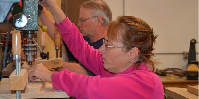 Darren and Teresa Martin-Gay work side-by-side to create handmade wooden toys. (Photos by Amanda McFarland)