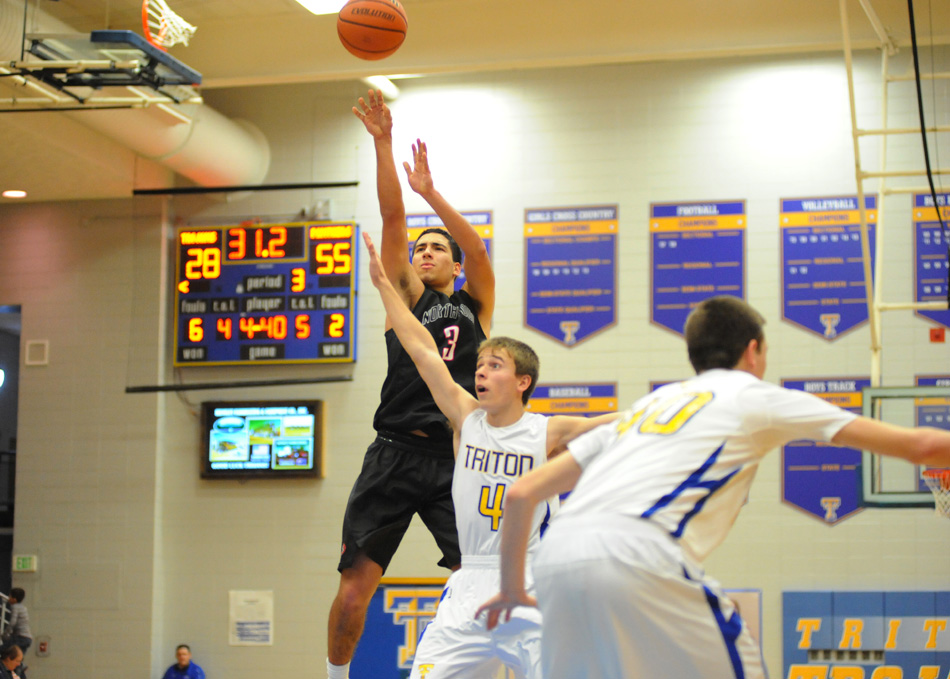 NorthWood's Braxton Linville elevates for a jumper Friday night at Triton. Linville and Panthers would roll 64-43. (Photos by Mike Deak)