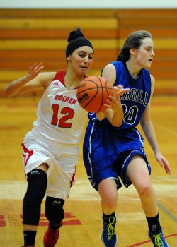 Goshen guard Tahya Bruce steals the ball from Carroll's Kelly Damman.