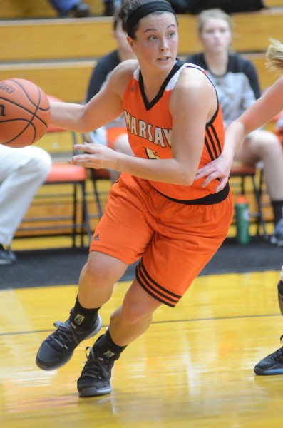 Page Desenberg makes a move along the baseline for Warsaw Saturday at LaPorte. The Tigers dropped a 53-42 final.