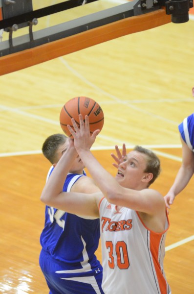 Braxton Minix goes up for a bucket for Warsaw.