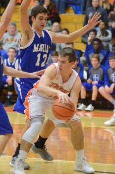 Jaceb Burish looks to pass the ball for the Tigers.