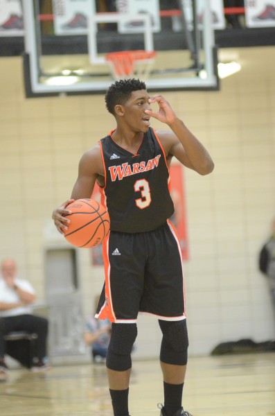 Paul Marandet calls out a play while running the show for Warsaw Friday night. The senior was sensational with 23 points as the undefeated Tigers topped NorthWood 51-35.