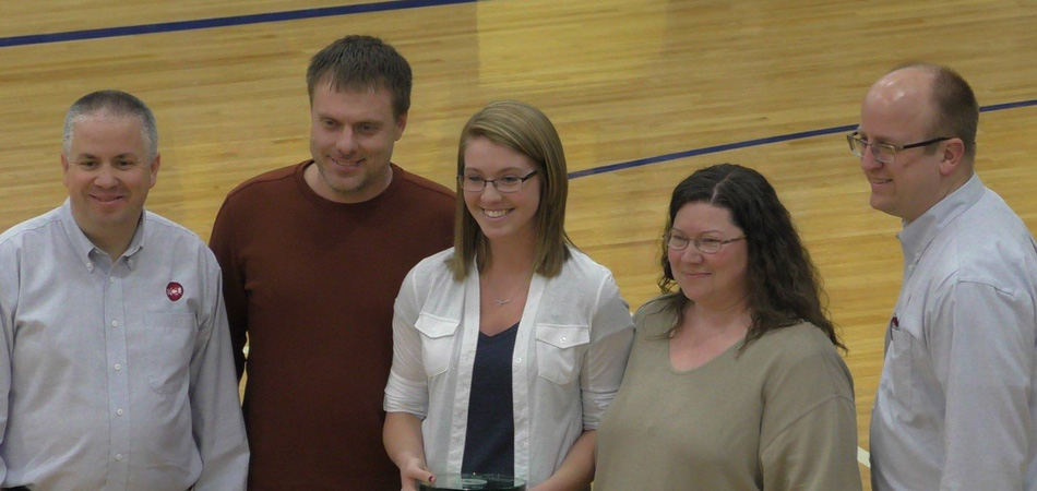 Triton senior Brooklyn Beatty is surrounded by family and TCU representatives after winning the WB Hawkins scholarship Saturday night at the Bi-County basketball tournament. (Photo provided by Orion Lemler)