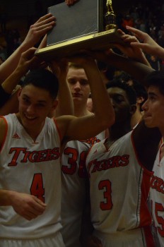 Riley Rhoades and Paul Marandet hoist the NLC trophy.