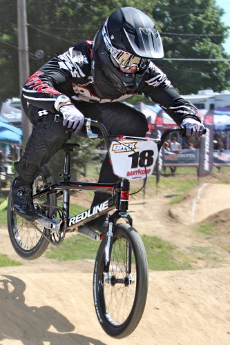 With the visibility of bicycle motocross today, it’s even possible to have college paid for with the sport. Warsaw resident Shannon Taylor currently has athletic BMX scholarship funding to attend Marian College and is part of the Marian University Knights Cycling Team. He’s shown here at a Hire Park race.