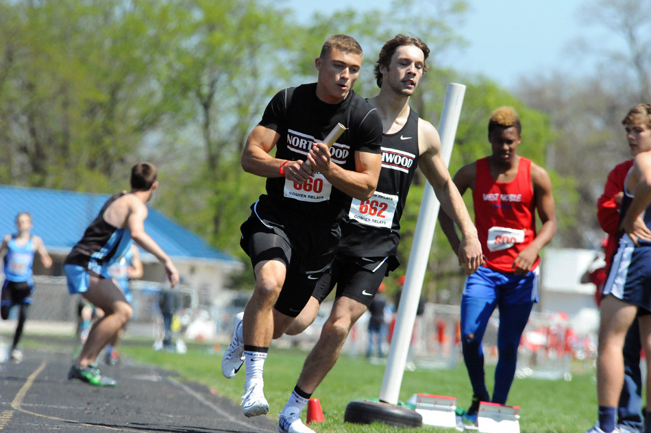 NorthWood's Bailey Gessinger heads into the final leg of the 4x100 relay, which Gessinger and the Panthers claimed 10 points to win the Goshen Relays Class B championship Saturday afternoon. (Photos by Mike Deak)