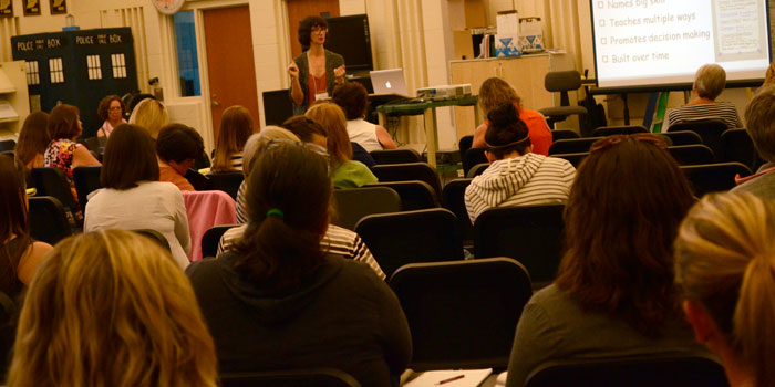 Teachers listen to a presentation by Kristi Mraz.