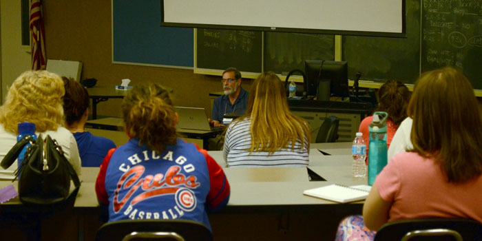 Math literacy was also a focus of this year's All Write conference. Pictured is math educator Steve Leinwand with a group of teachers.