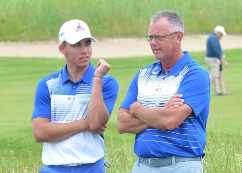 Anderson and Triton coach Jack Carpenter discuss strategy during Saturday's round. 