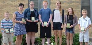 Grand champions in the communication and expressive arts and engineering and technological science, from left are Logan Schuller, Elizabeth Zorn, Madison O'Connell, Thomas Coulter, Allison Miller, Allison Heinrich and Jay Duncan.