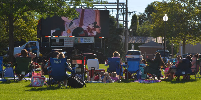 Moviegoers arrive at Central Park as a preview movie plays. (Photos by Amanda McFarland)