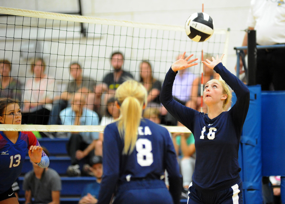 LCA's Kyla Kohler attempts to set up teammate Baylee Wiley for a kill attempt Tuesday against Whitko.