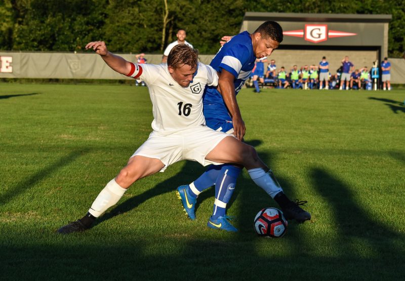 Thomas Tydeman of Grace battles for possession of the ball Saturday. The host Lancers tied Bluefield 1-1 (Photo provided by Chantel Shetler)