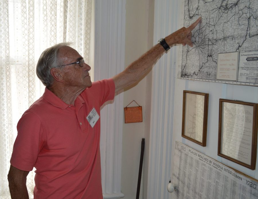 Probably Bill Huffer’s favorite display room in the Old Jail Museum, Warsaw, is the transportation room. Here he is pointing out on a map part of Indiana’s extensive interurban railway network. Huffer is a tour guide for the museum.