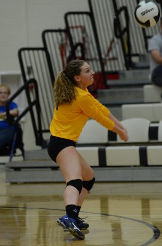 Standout libero Quinn Downing makes a pass Saturday night.