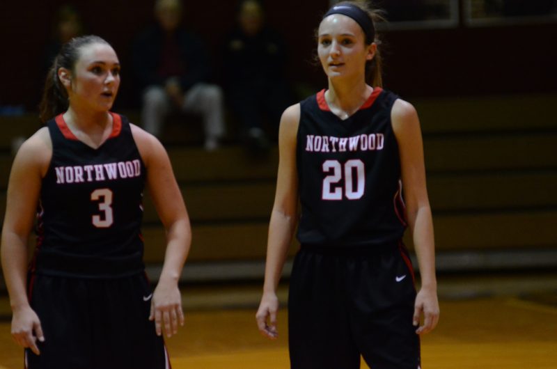 Taitlyn Trenshaw (left) and Mackenzie Bergman talk strategy late in the game for NorthWood.