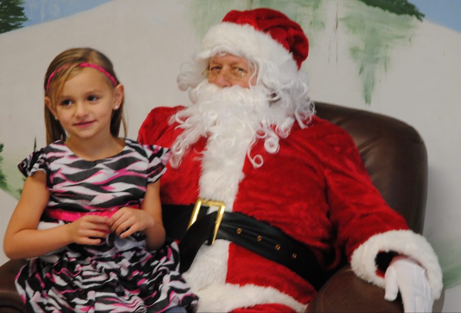 Amara McClure is shown with Santa Claus in 2015 in North Webster.