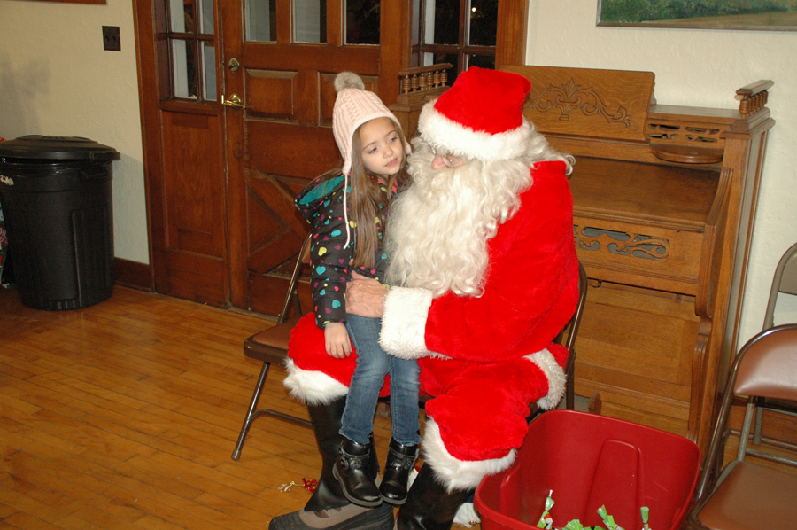 Anna Lopez of Syracuse had a nice, long chat about what she wants for Christmas. (Photo by David Hazledine)